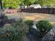 Well-maintained backyard with a neat fence and greenery, perfect for outdoor activities at 3332 Draper Ave, Charlotte, NC 28205