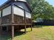 A beautiful backyard with a raised deck and lush greenery, perfect for outdoor enjoyment at 3332 Draper Ave, Charlotte, NC 28205