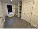 Modern bathroom features a soaking tub under a window and a glass-enclosed shower at 3332 Draper Ave, Charlotte, NC 28205