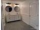 Bathroom featuring double sinks, modern fixtures, and tile flooring at 3332 Draper Ave, Charlotte, NC 28205