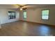 Spacious bedroom with a ceiling fan and plenty of natural light from multiple windows at 3332 Draper Ave, Charlotte, NC 28205