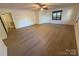 Bright bedroom featuring a ceiling fan and plenty of natural light from multiple windows at 3332 Draper Ave, Charlotte, NC 28205