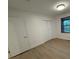 Simple bedroom with hardwood floors, window and closet at 3332 Draper Ave, Charlotte, NC 28205