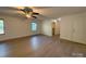 Bright bedroom featuring a ceiling fan, neutral paint, and access to a closet at 3332 Draper Ave, Charlotte, NC 28205