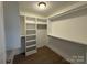 Walk-in closet with ample shelving and hanging space offers organized storage at 3332 Draper Ave, Charlotte, NC 28205