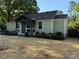 Charming home with a beautifully landscaped front yard, showcasing curb appeal at 3332 Draper Ave, Charlotte, NC 28205