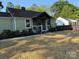 Charming home with a welcoming front porch and meticulously maintained landscape at 3332 Draper Ave, Charlotte, NC 28205