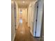 Bright hallway showcasing hardwood floors and a view of the front door at 3332 Draper Ave, Charlotte, NC 28205