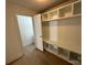 Mudroom features built in shelves and seating at 3332 Draper Ave, Charlotte, NC 28205