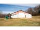 Large barn in backyard of property with a swing set at 3991 Bunker Hill School Rd, Claremont, NC 28610