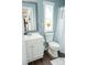 This bright bathroom features a white sink and yellow flowers at 3991 Bunker Hill School Rd, Claremont, NC 28610