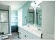 This bathroom features a double sink vanity and tile surround shower at 3991 Bunker Hill School Rd, Claremont, NC 28610