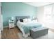 This bedroom boasts hardwood floors, natural light, and neutral paint tones at 3991 Bunker Hill School Rd, Claremont, NC 28610