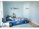 Fun bedroom features a race car bed, blue accents, and playful decor at 3991 Bunker Hill School Rd, Claremont, NC 28610