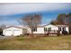 Charming home featuring a detached two-car garage and inviting front porch at 3991 Bunker Hill School Rd, Claremont, NC 28610
