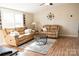 Inviting living room featuring hardwood floors, modern decor, and comfortable leather couches at 3991 Bunker Hill School Rd, Claremont, NC 28610