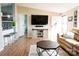 Open-concept living room adjacent to the kitchen with hardwood floors and stylish decor at 3991 Bunker Hill School Rd, Claremont, NC 28610