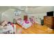 bedroom with hardwood floors, toys, and large window with neutral walls at 401 N Inman Ave, Bessemer City, NC 28016