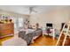 Bright bedroom with neutral walls, hardwood floors, and a large window at 401 N Inman Ave, Bessemer City, NC 28016
