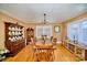 Traditional dining room with hardwood floors, a large wooden table, and ample seating at 401 N Inman Ave, Bessemer City, NC 28016