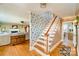 Inviting entryway featuring hardwood floors, decorative wallpaper, and a staircase to the upper level at 401 N Inman Ave, Bessemer City, NC 28016