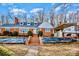 Charming brick home with a covered carport and inviting front entrance staircase at 401 N Inman Ave, Bessemer City, NC 28016