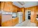 View of kitchen appliances and cabinets with view to another room at 401 N Inman Ave, Bessemer City, NC 28016
