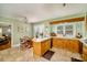 Bright kitchen with tile floors, wooden cabinets, and a charming breakfast nook at 401 N Inman Ave, Bessemer City, NC 28016