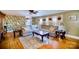 Spacious living room with hardwood floors, stylish rug, and comfortable sectional sofa at 401 N Inman Ave, Bessemer City, NC 28016