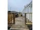 Exterior view of back deck with wood railings and a decorative chiminea at 412 Sumter St # A, Clover, SC 29710