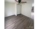 An ample bedroom features wood-look flooring, ceiling fan, and closet at 412 Sumter St # A, Clover, SC 29710