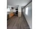 A well-lit kitchen boasts wood cabinets, stainless steel appliances, and modern flooring at 412 Sumter St # A, Clover, SC 29710