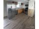 Kitchen featuring stainless steel appliances and wood-look flooring, providing a modern, functional space at 412 Sumter St # A, Clover, SC 29710
