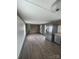 Open living area with modern vinyl floors, stainless steel refrigerator and good natural light at 412 Sumter St # A, Clover, SC 29710