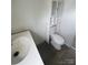 Neutral bathroom with storage cabinet above toilet at 412 Sumter St # A, Clover, SC 29710