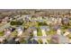 A neighborhood aerial view displays lush trees, well-manicured lawns, and homes with manicured shrubbery at 4405 Zee Ct, Monroe, NC 28110