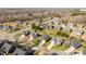 An aerial view shows a pool and well-maintained homes in a beautiful community surrounded by mature trees at 4405 Zee Ct, Monroe, NC 28110