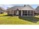 The house has a large backyard with a cozy screened porch and an outdoor patio at 4405 Zee Ct, Monroe, NC 28110