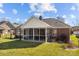 The home features a well-maintained backyard with a screened porch and garden at 4405 Zee Ct, Monroe, NC 28110
