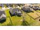 Aerial view of a well-manicured backyard with lush green grass, a screened-in porch, and privacy fencing at 4405 Zee Ct, Monroe, NC 28110