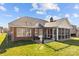 The house boasts a spacious backyard with a screened porch, perfect for entertaining at 4405 Zee Ct, Monroe, NC 28110