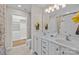 Bathroom with double vanity, tile floors, and large walk-in closet at 4405 Zee Ct, Monroe, NC 28110
