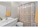 Bathroom with vanity, toilet, and shower featuring decorative curtain at 4405 Zee Ct, Monroe, NC 28110