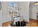 Elegant dining room features a large window and chandelier lighting, perfect for entertaining at 4405 Zee Ct, Monroe, NC 28110