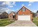 Attractive brick home with a two-car garage, tidy landscaping, and a welcoming entrance at 4405 Zee Ct, Monroe, NC 28110