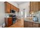 Well-equipped kitchen with granite countertops, stainless steel appliances, and ample cabinet space at 4405 Zee Ct, Monroe, NC 28110