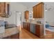 Modern kitchen featuring granite countertops, stainless steel appliances, and tile backsplash at 4405 Zee Ct, Monroe, NC 28110