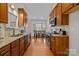 Spacious kitchen boasts granite counters, stainless appliances, and a bright breakfast nook at 4405 Zee Ct, Monroe, NC 28110