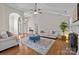 Bright living room boasts high ceilings, hardwood floors, and stylish furnishings at 4405 Zee Ct, Monroe, NC 28110