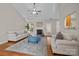 Inviting living room features a brick fireplace, hardwood floors, and comfortable seating at 4405 Zee Ct, Monroe, NC 28110